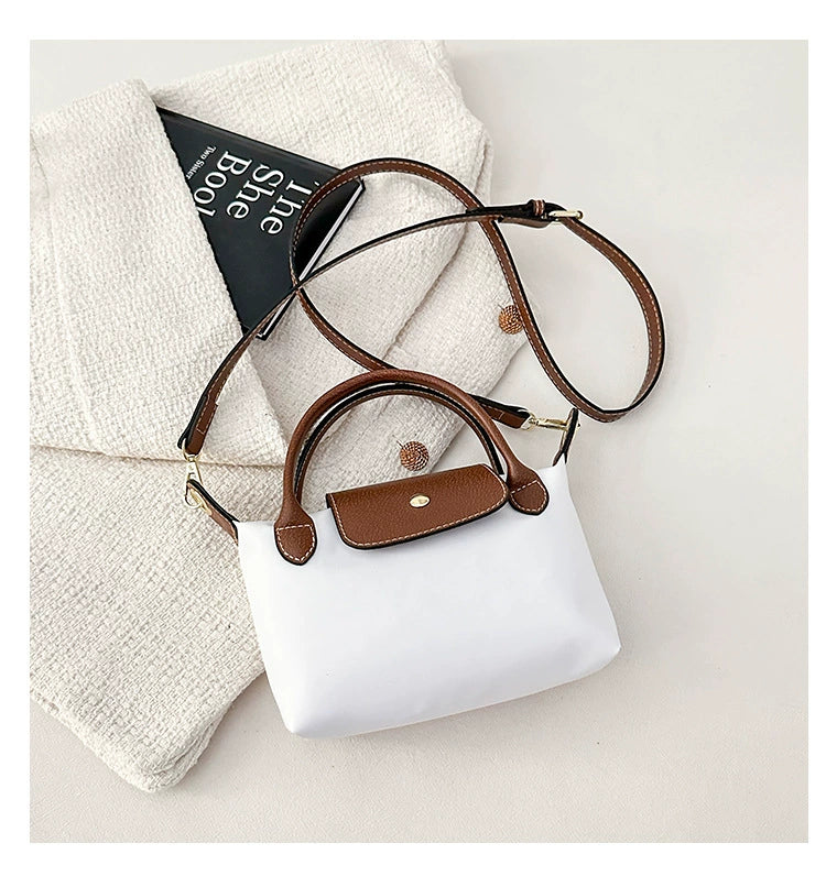 Nylon Crossbody Bag with Brown Leather Trim - Compact Foldable Handbag with Adjustable Strap