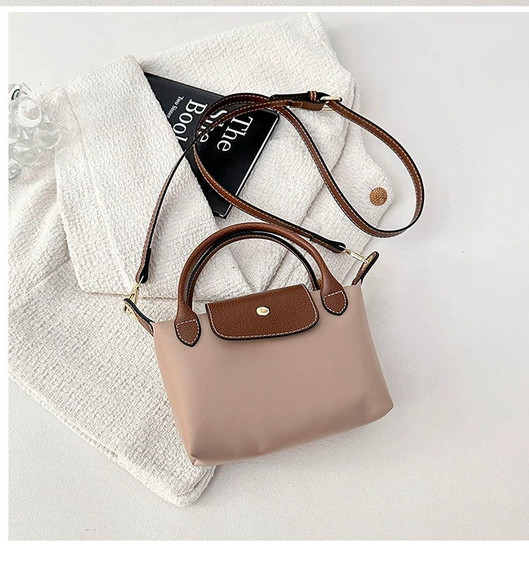 Nylon Crossbody Bag with Brown Leather Trim - Compact Foldable Handbag with Adjustable Strap