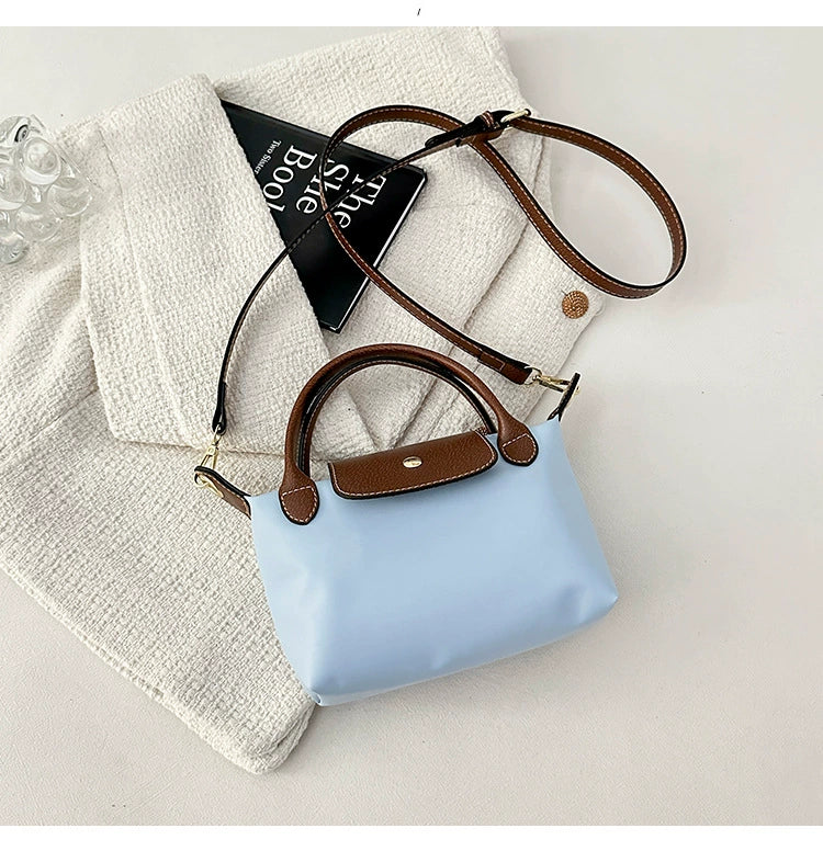 Nylon Crossbody Bag with Brown Leather Trim - Compact Foldable Handbag with Adjustable Strap