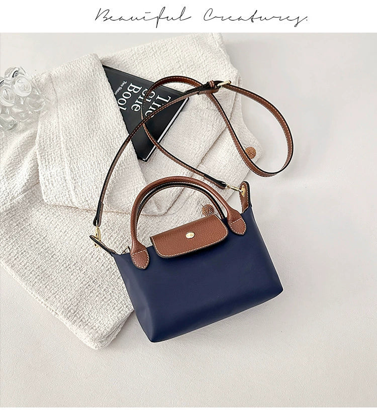 Nylon Crossbody Bag with Brown Leather Trim - Compact Foldable Handbag with Adjustable Strap