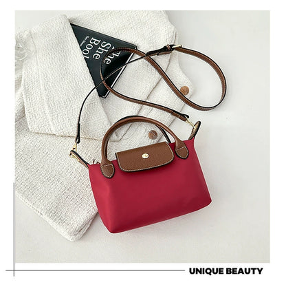 Nylon Crossbody Bag with Brown Leather Trim - Compact Foldable Handbag with Adjustable Strap